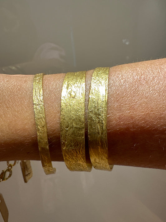 3 gold bracelets