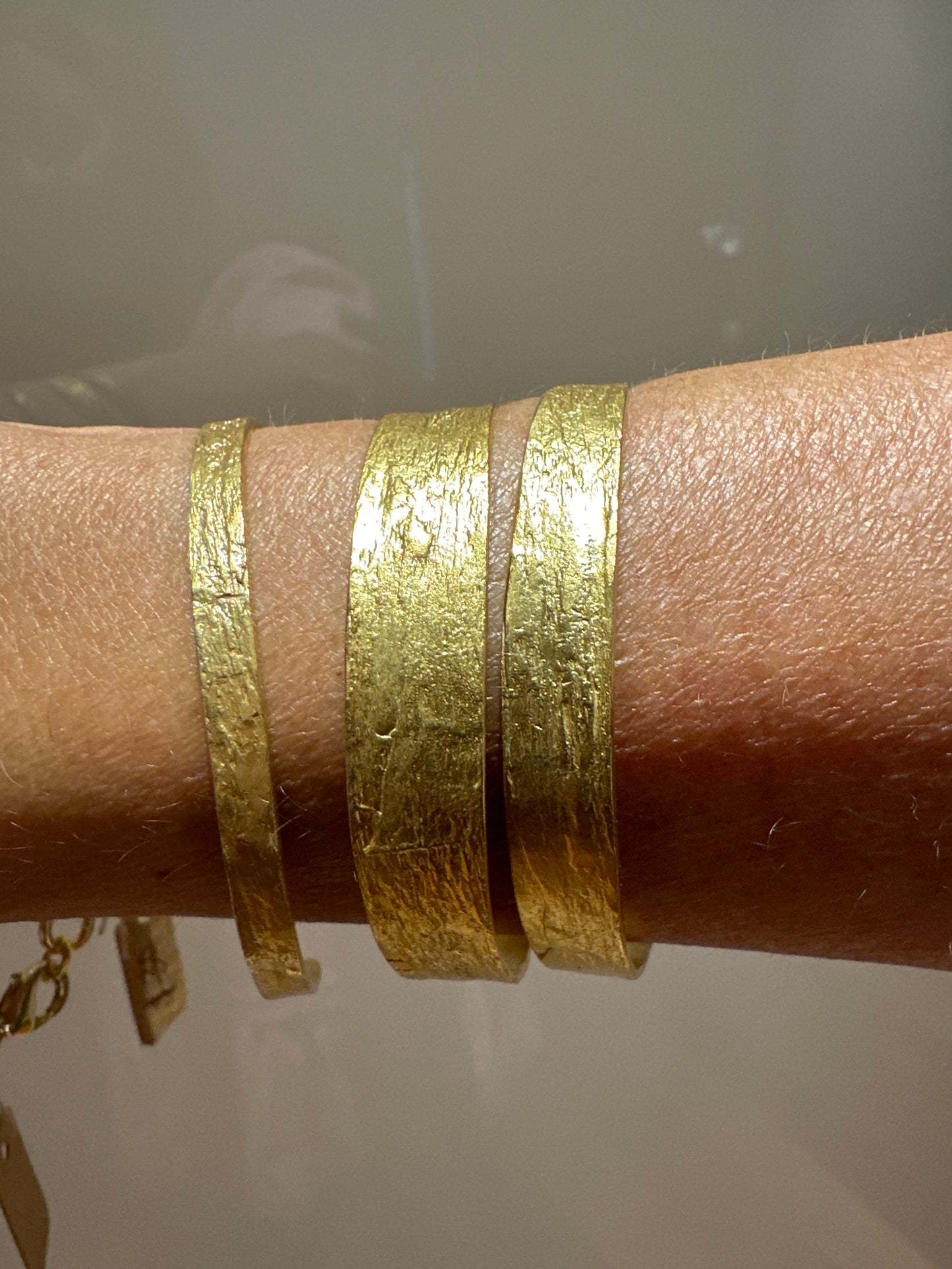 3 gold bracelets